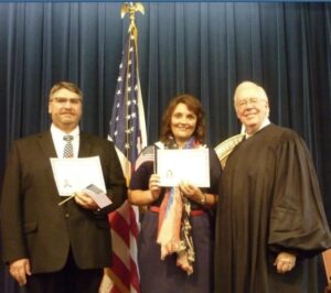 two people getting citizenship in the US