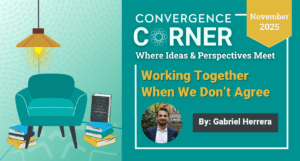 Blog article cover image for “Convergence Corner.” Teal and gold layout with the headline “Working Together When We Don’t Agree,” byline “By: Gabriel Herrera,” and a circular author photo. Date badge: “November 2025.” Left side shows a cozy teal chair, lamp, stacked books, and a framed book.