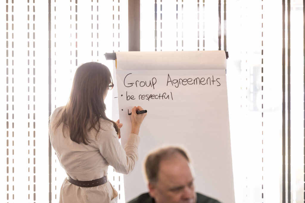 Convergence CEO and facilitator Mariah Levison begins to write down group agreements (1)